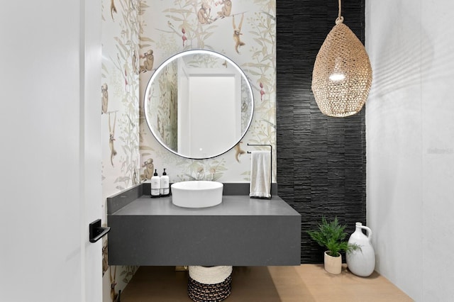 bathroom with wallpapered walls