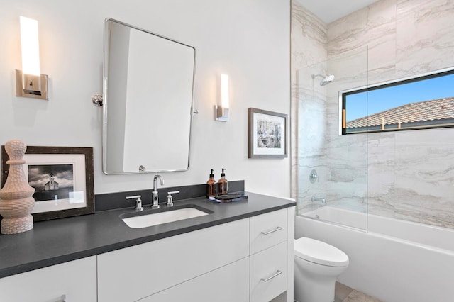 bathroom featuring shower / bathing tub combination, toilet, and vanity