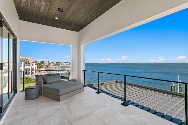 balcony featuring a water view