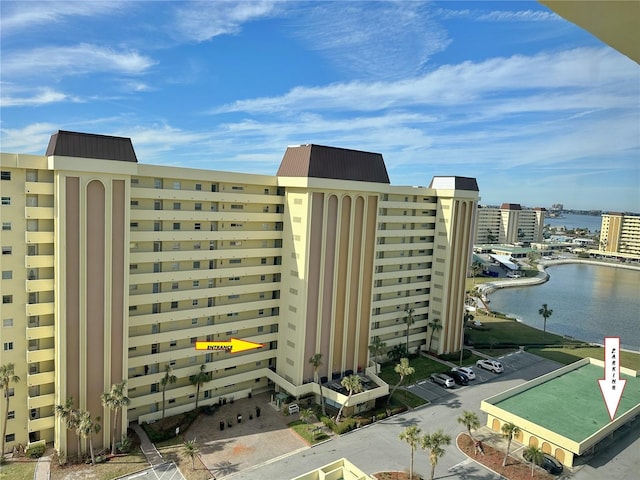 view of property featuring a city view and a water view