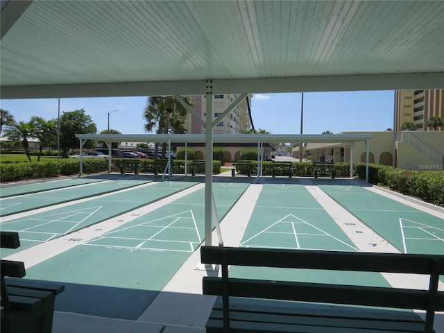 view of property's community featuring shuffleboard