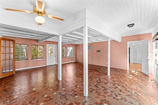 interior space featuring beamed ceiling and ceiling fan