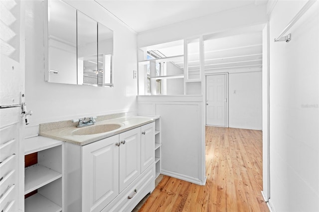 bathroom with vanity and wood finished floors