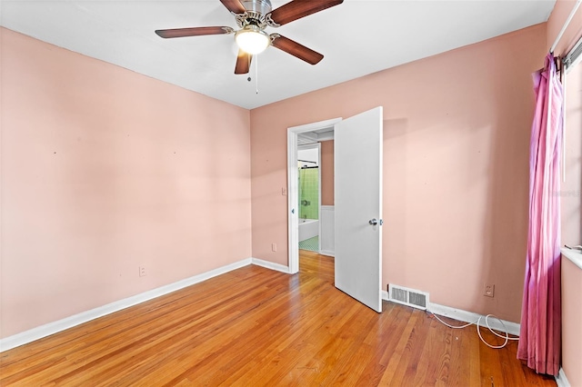 unfurnished bedroom featuring light wood-type flooring, visible vents, baseboards, and ceiling fan