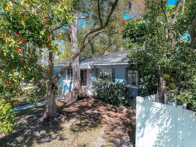 view of front of house featuring fence