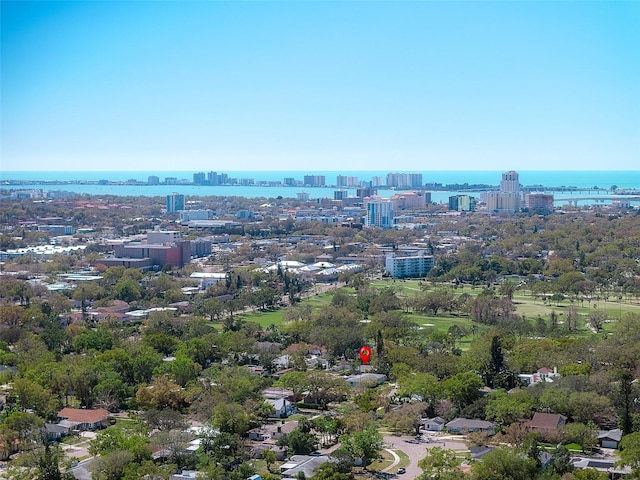 aerial view featuring a view of city and a water view