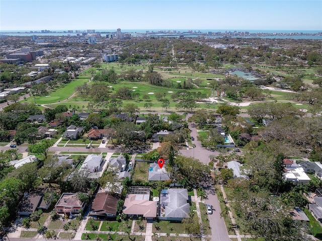 birds eye view of property with golf course view and a residential view