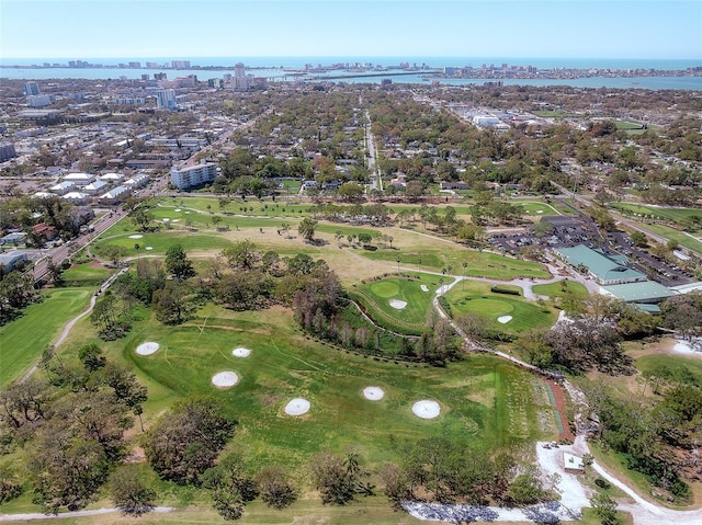 birds eye view of property with a water view, view of golf course, and a view of city