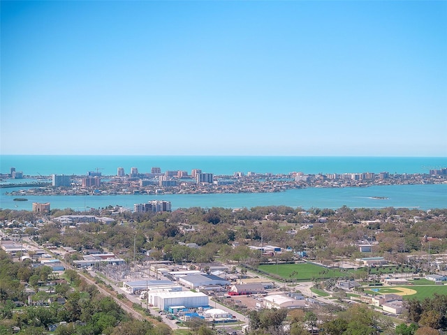 birds eye view of property with a view of city and a water view