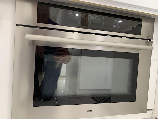 interior details featuring stainless steel oven