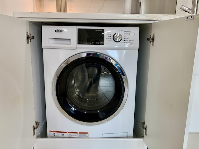 laundry room with washer / dryer and laundry area