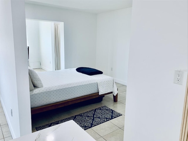 tiled bedroom with baseboards