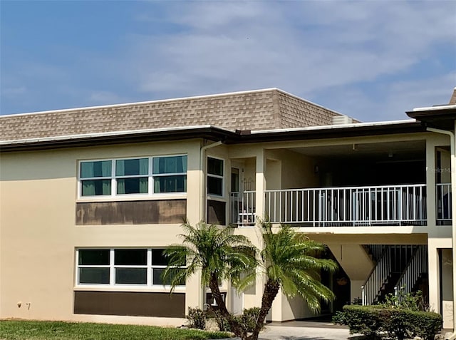 view of property featuring stairs