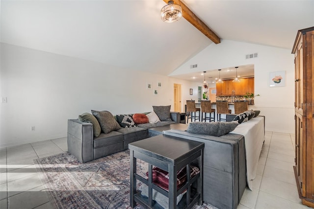 living room featuring visible vents, high vaulted ceiling, beamed ceiling, and light tile patterned flooring