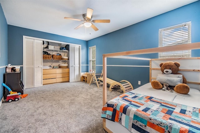 bedroom featuring a closet, ceiling fan, and carpet