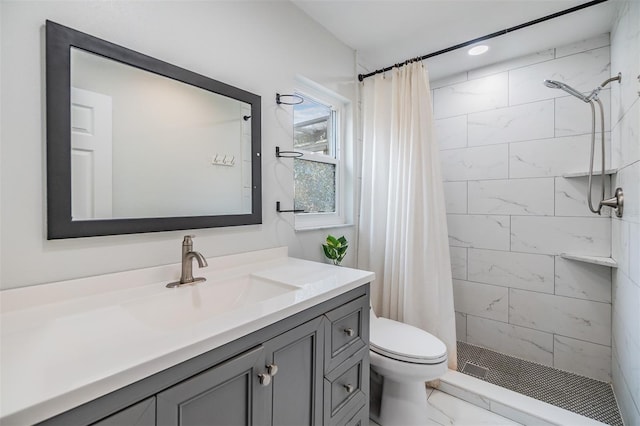 bathroom featuring vanity, recessed lighting, a stall shower, toilet, and marble finish floor