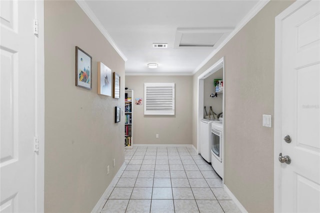 washroom with attic access, ornamental molding, laundry area, light tile patterned flooring, and separate washer and dryer