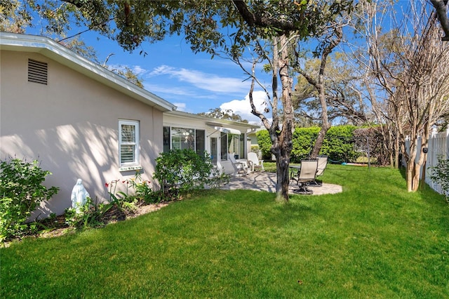 view of yard featuring a patio and fence