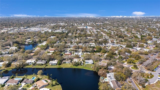 drone / aerial view featuring a residential view and a water view