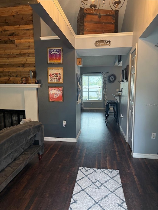 hallway featuring baseboards and wood finished floors