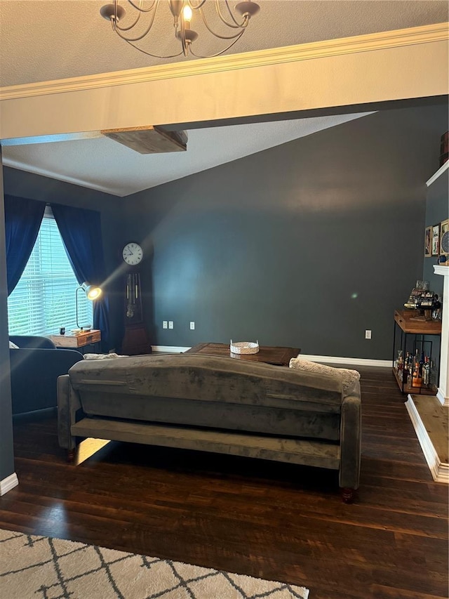 bedroom with wood finished floors, baseboards, vaulted ceiling, crown molding, and a chandelier