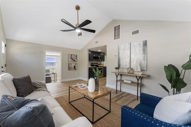 living room with visible vents and wood finished floors