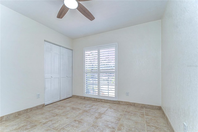 unfurnished bedroom featuring a closet and ceiling fan