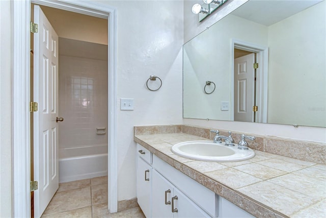 full bathroom featuring a bathing tub, walk in shower, vanity, and tile patterned flooring