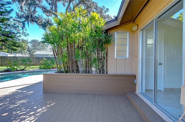 view of patio with a fenced in pool and fence