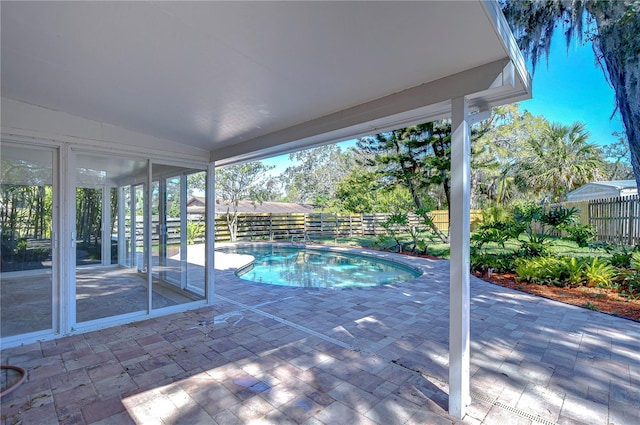 view of pool featuring a patio area, a fenced in pool, and a fenced backyard