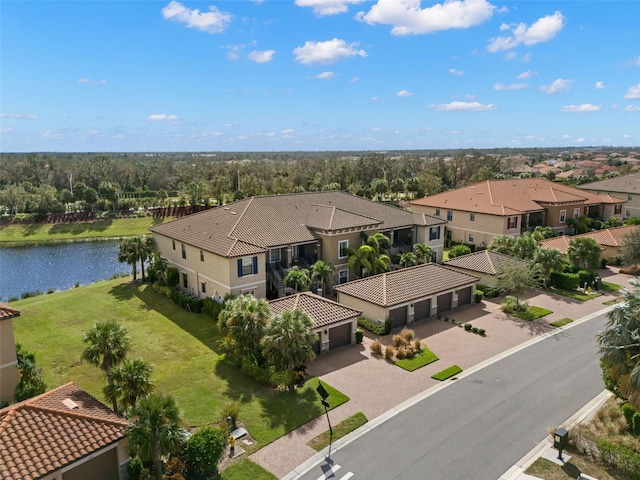 bird's eye view featuring a water view and a view of trees