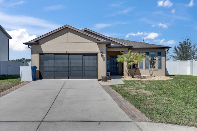 ranch-style house featuring a front lawn, fence, concrete driveway, stucco siding, and a garage