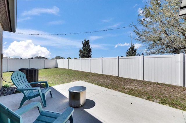 view of patio with central AC unit and a fenced backyard