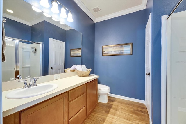 bathroom featuring visible vents, a shower stall, toilet, ornamental molding, and vanity