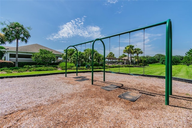 view of home's community with a yard and playground community