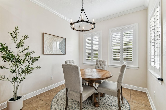 dining space with an inviting chandelier, crown molding, light tile patterned flooring, and baseboards