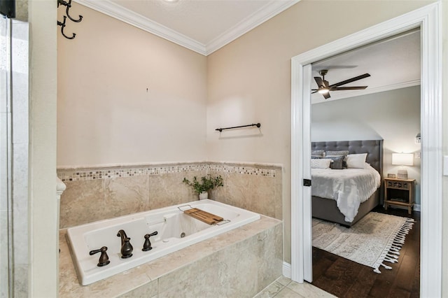 full bathroom with ceiling fan, a jetted tub, ornamental molding, and ensuite bathroom