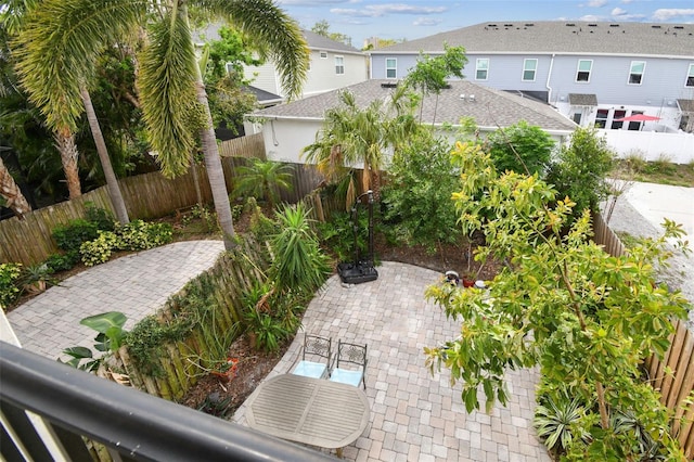 view of patio / terrace with a residential view and a fenced backyard