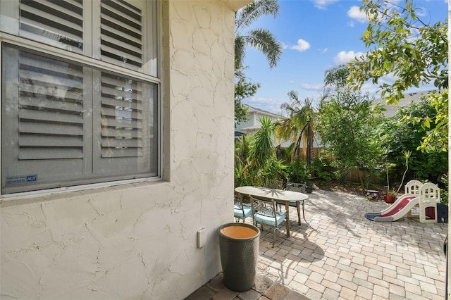 view of patio / terrace featuring outdoor dining area and fence