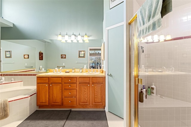 bathroom featuring a sink, a garden tub, a shower stall, and tile patterned floors