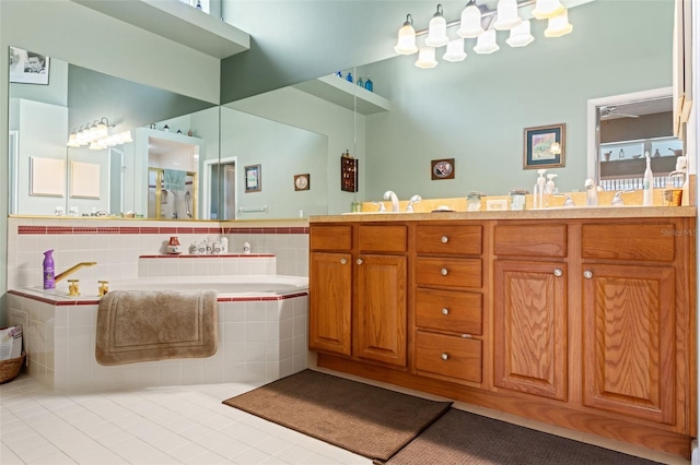 bathroom with tile patterned flooring, double vanity, a bath, and a sink