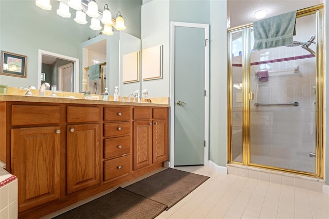 bathroom with a sink, a stall shower, and double vanity