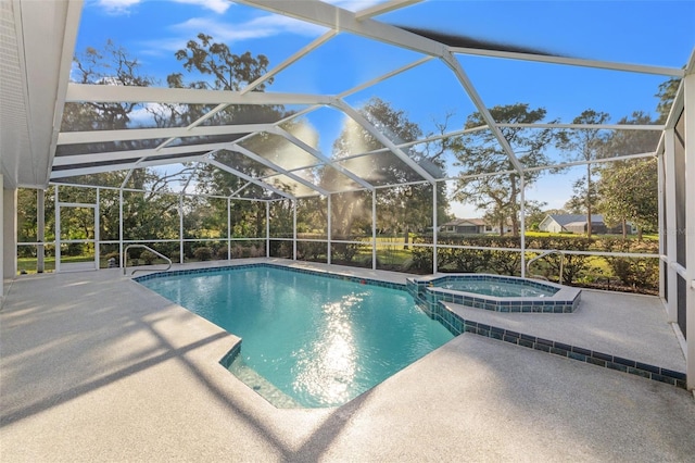 view of swimming pool featuring a patio, a pool with connected hot tub, and a lanai