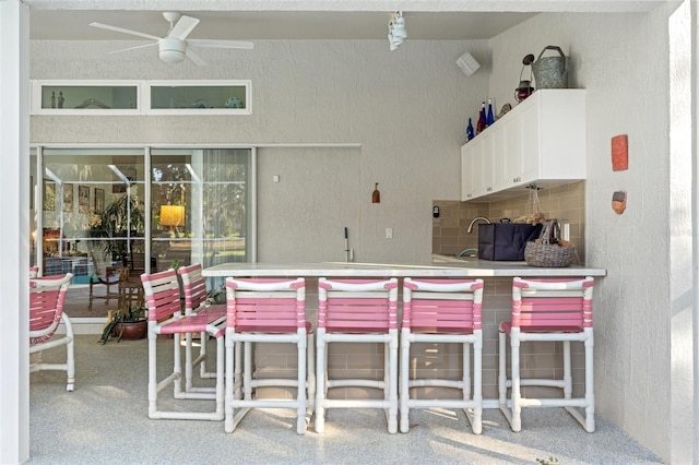 view of patio with a sink and ceiling fan