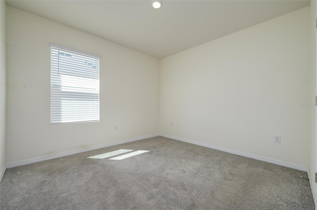 empty room with recessed lighting, baseboards, and carpet floors