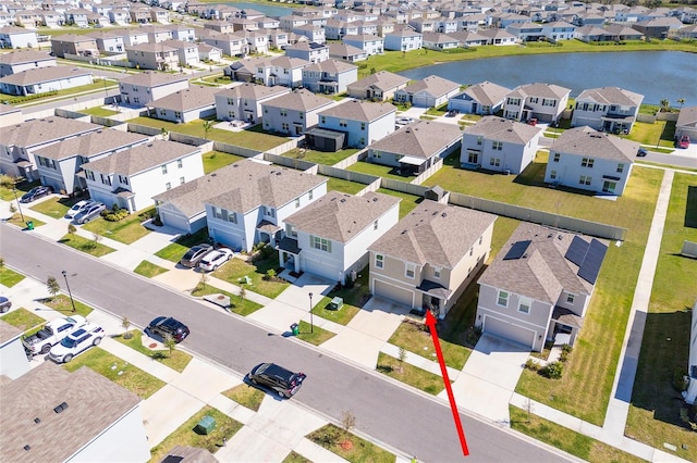 aerial view with a residential view and a water view