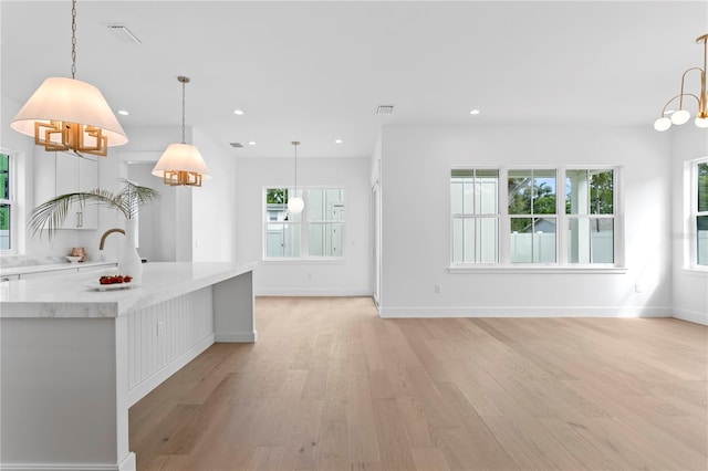 kitchen featuring recessed lighting, light wood-type flooring, visible vents, and white cabinets