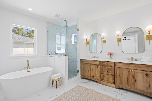 full bath featuring a marble finish shower, marble finish floor, and a sink