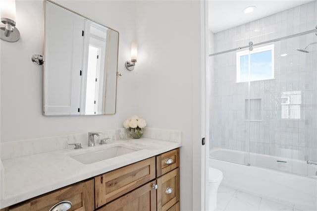 bathroom featuring combined bath / shower with glass door, toilet, marble finish floor, and vanity