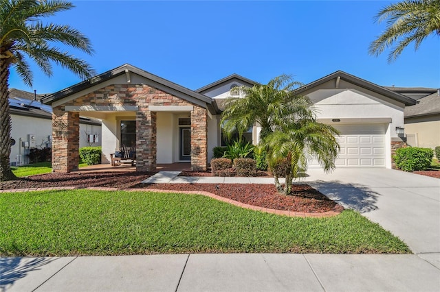 8307 Bluevine Sky Dr, Land O Lakes, FL 34637 - view of front facade with stone siding, concrete driveway, an attached garage, and stucco siding